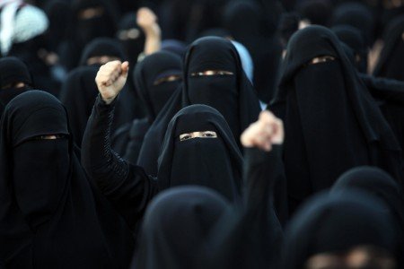 Yemeni pro-democratic female protestors, wearing the niqab, shout slogans during a demonstration in Sanaa on January 3, 2013, demanding a quicker implementation of President Abdrabuh Mansur Hadi's latest orders to restructure Yemen's military. AFP PHOTO/ MOHAMMED HUWAIS