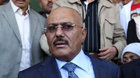 Former Yemeni president Ali Abdullah Saleh (L) and Yemen's Minister of Communications Ahmed Bin Daghr (R) attend celebrations on the occasion of the first anniversary of the handover of power in Sanaa on February 27, 2013. Saleh stepped down after 33-years at the helm in February 2011 and formally handed power to his then deputy, Abdrabuh Mansur Hadi. AFP PHOTO/ MOHAMMED HUWAIS (Photo credit should read MOHAMMED HUWAIS/AFP/Getty Images)